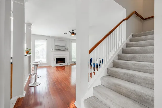 a view of entryway and hall with wooden floor