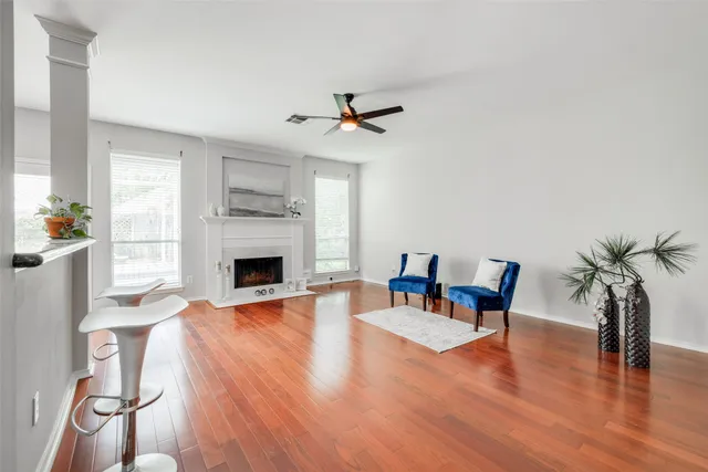a living room with furniture fireplace and window