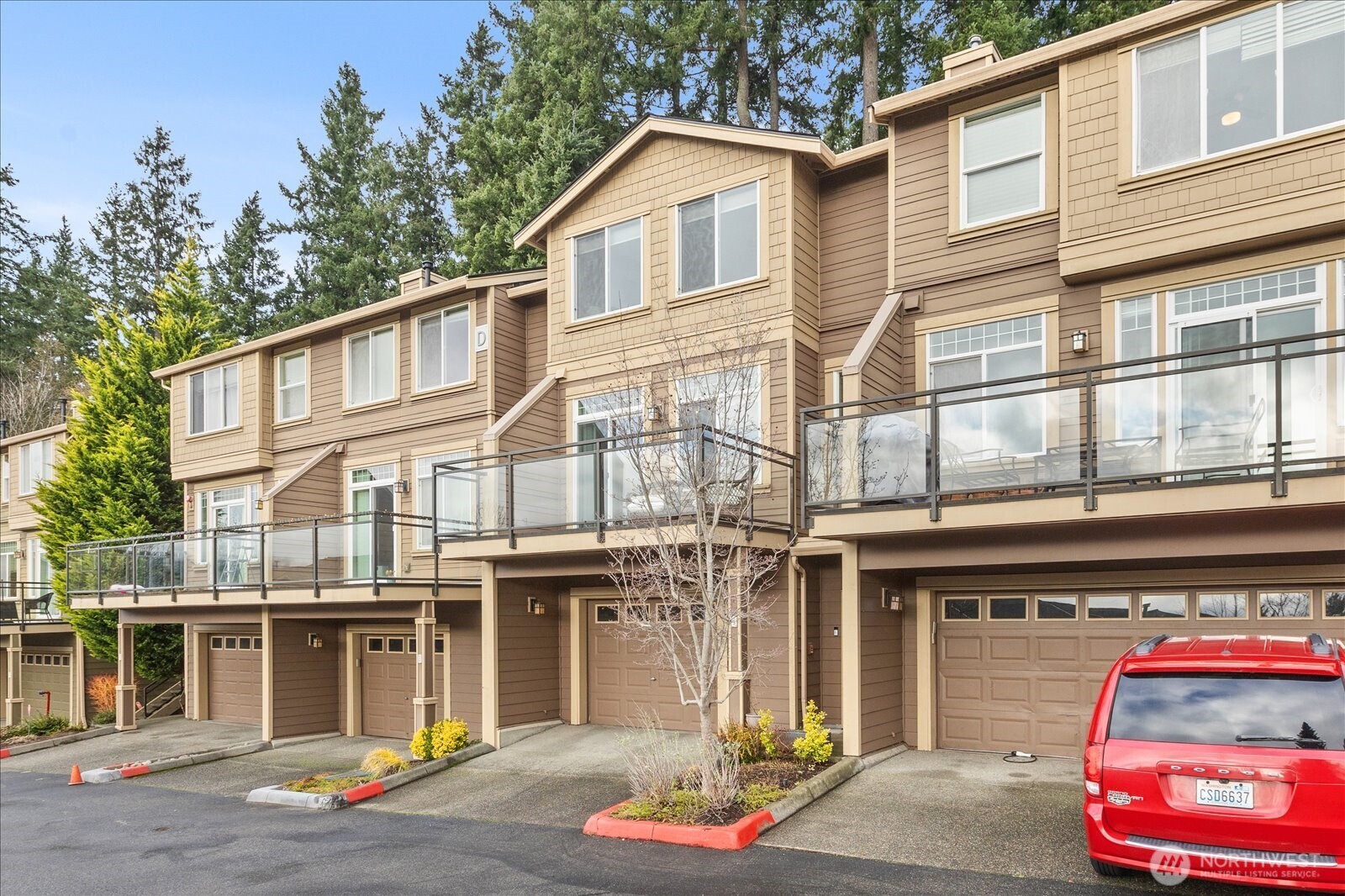 23300 Southeast Black Nugget Road, Unit D3 Issaquah, WA 98029 - Photo 1 of 35 a front view of a building with street