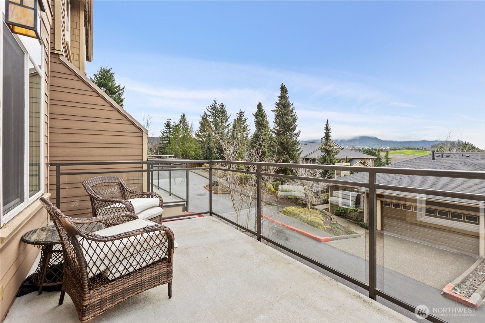 23300 Southeast Black Nugget Road, Unit D3 Issaquah, WA 98029 - Photo 33 of 35 a view of a balcony with chairs