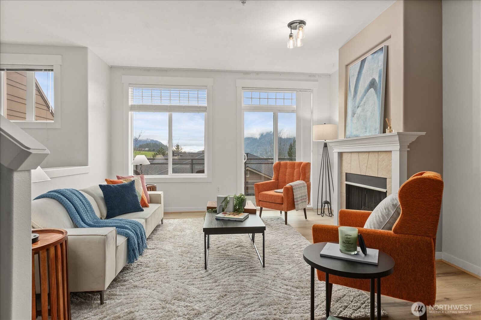 23300 Southeast Black Nugget Road, Unit D3 Issaquah, WA 98029 - Photo 4 of 35 a living room with furniture a fireplace and a window