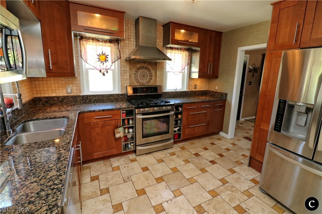848 Lander Road Cleveland, OH 44143 - Photo 5 of 30 DINNER ANYONE?!? I'M SURE ANYONE WOULD BE HAPPY EATING ANYTHING OUT OF THIS IMMACULATE KITCHEN WITH TRAVERTINE MARBLE FLOORING & STAINLESS APPLIANCES... 2ND'S ANYONE
