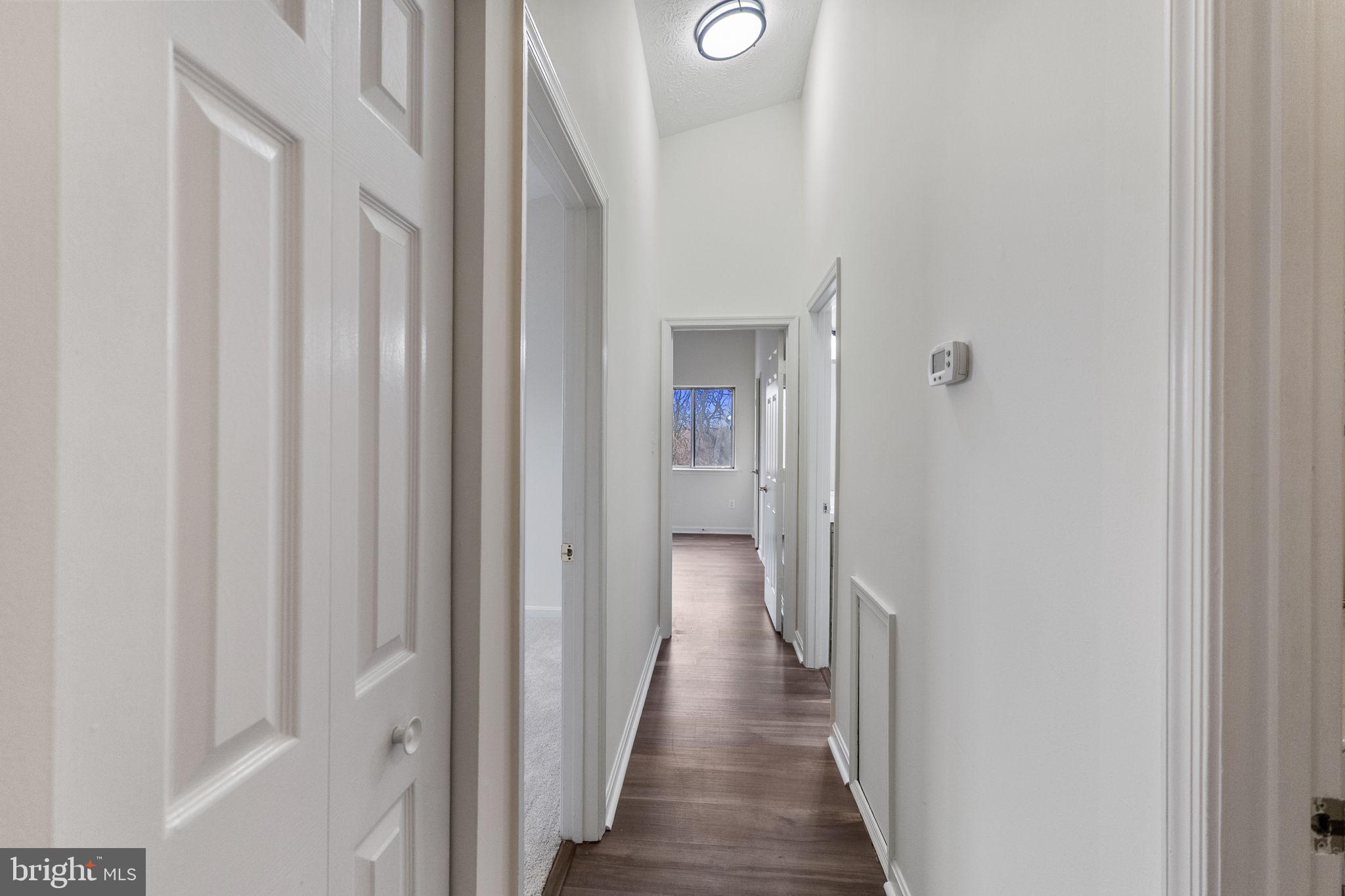 2141 Wainwright Court, Unit 2A Frederick, MD 21702 - Photo 14 of 30 hall to BRs with vaulted ceiling