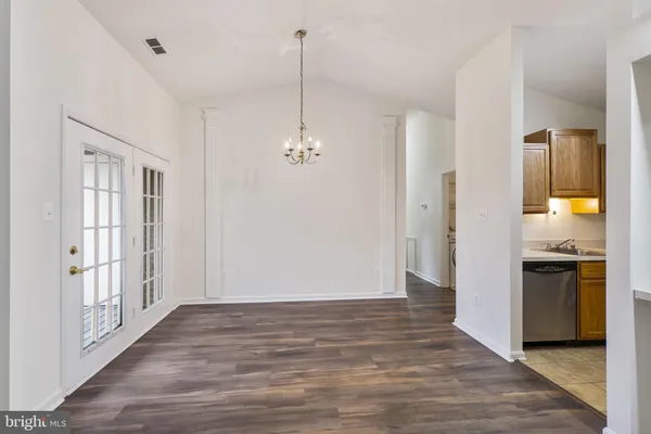 a view of a kitchen from the hallway