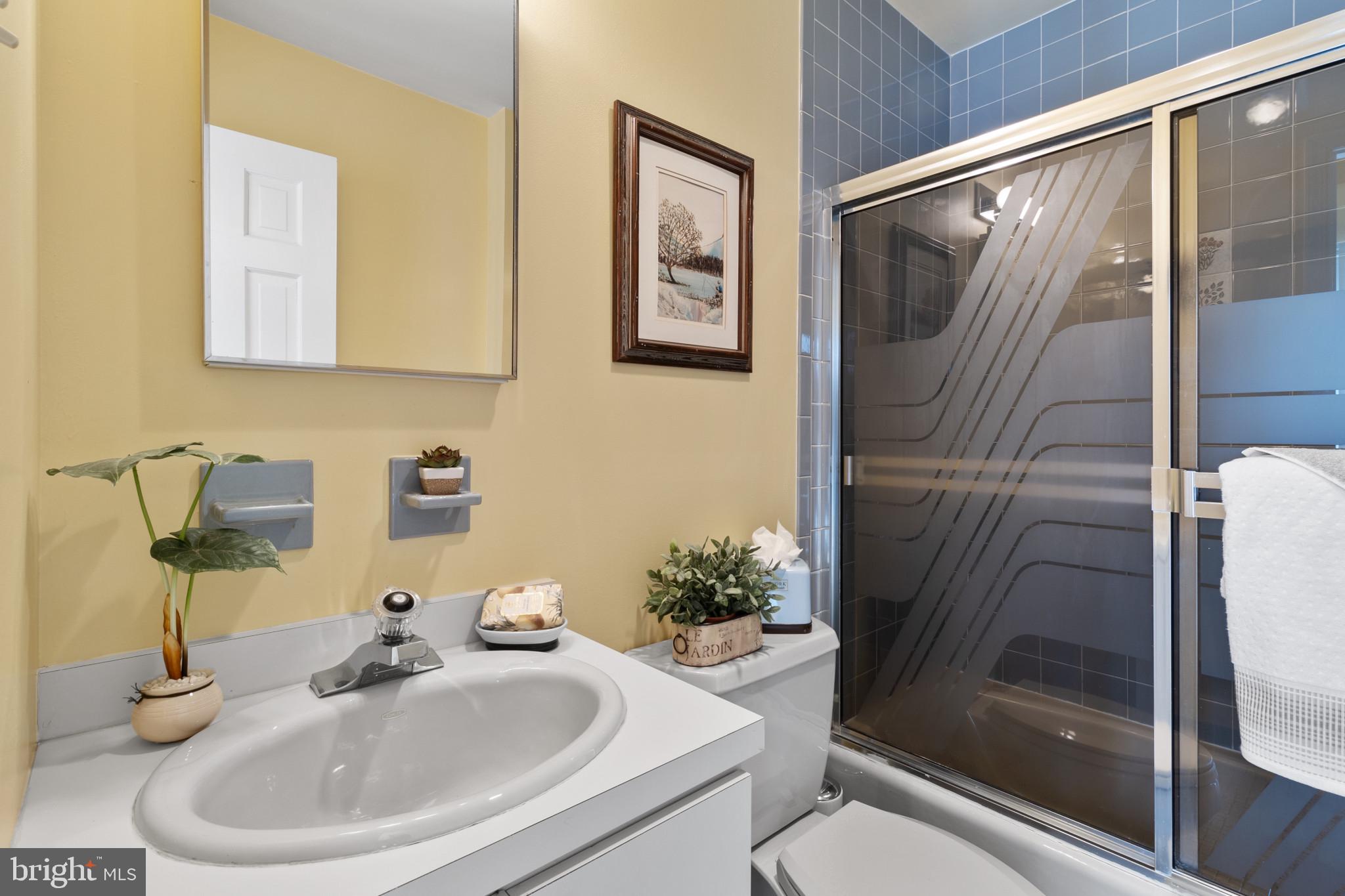 133 Plum Street Moorestown, NJ 08057 - Photo 17 of 54 a bathroom with a sink and a mirror