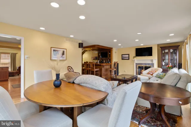 a living room with furniture a couch and potted plant