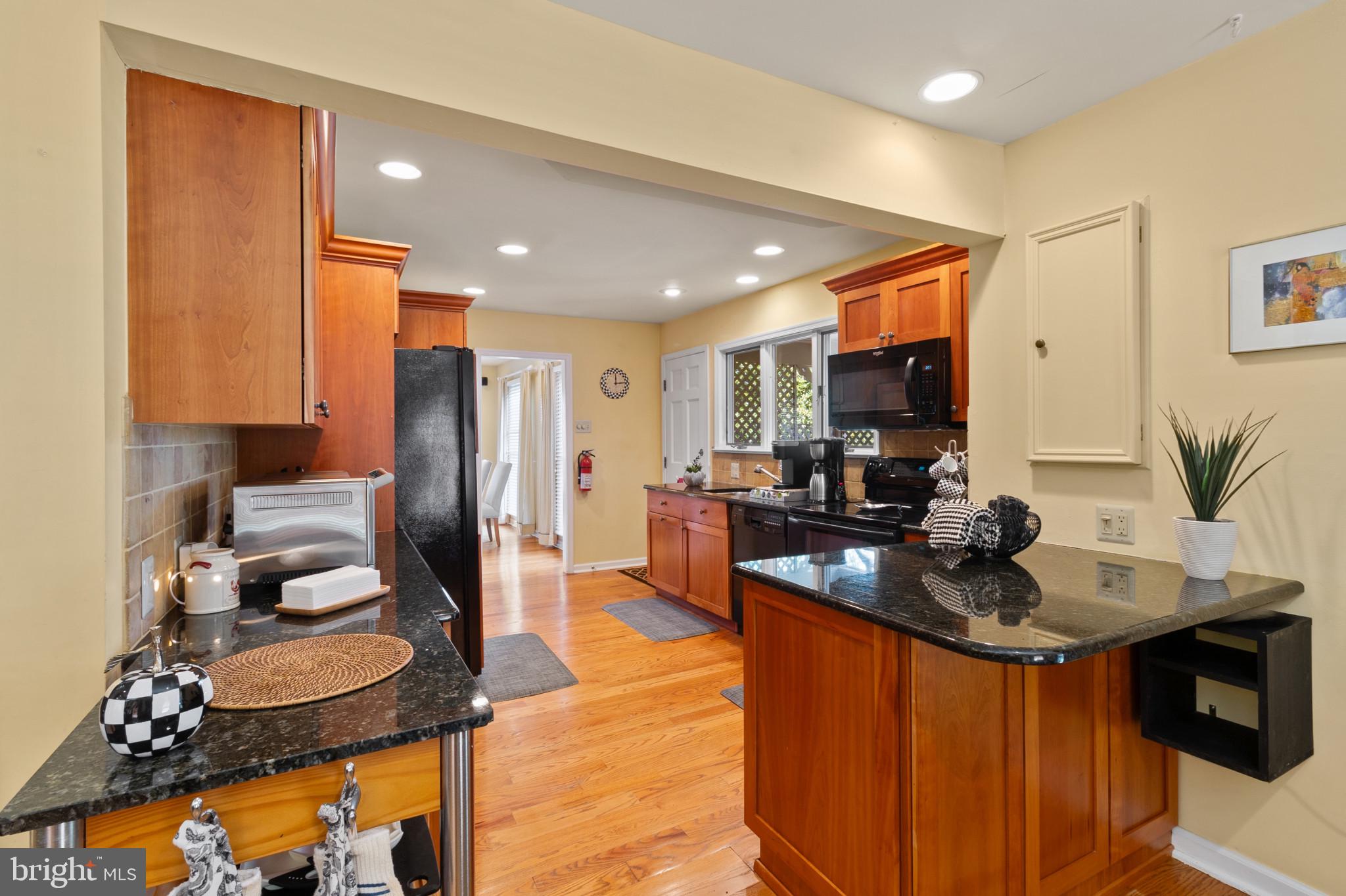 133 Plum Street Moorestown, NJ 08057 - Photo 25 of 54 a kitchen with stainless steel appliances granite countertop a sink refrigerator and microwave