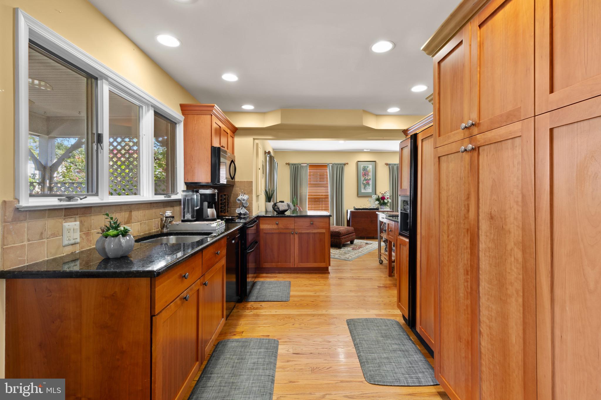 133 Plum Street Moorestown, NJ 08057 - Photo 27 of 54 a kitchen with stainless steel appliances granite countertop sink refrigerator and window