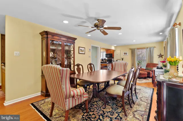 a view of a dining room with furniture and window