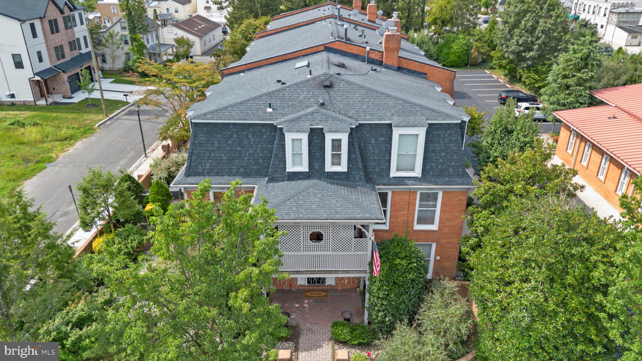 133 Plum Street Moorestown, NJ 08057 - Photo 3 of 54 an aerial view of multiple houses with a yard