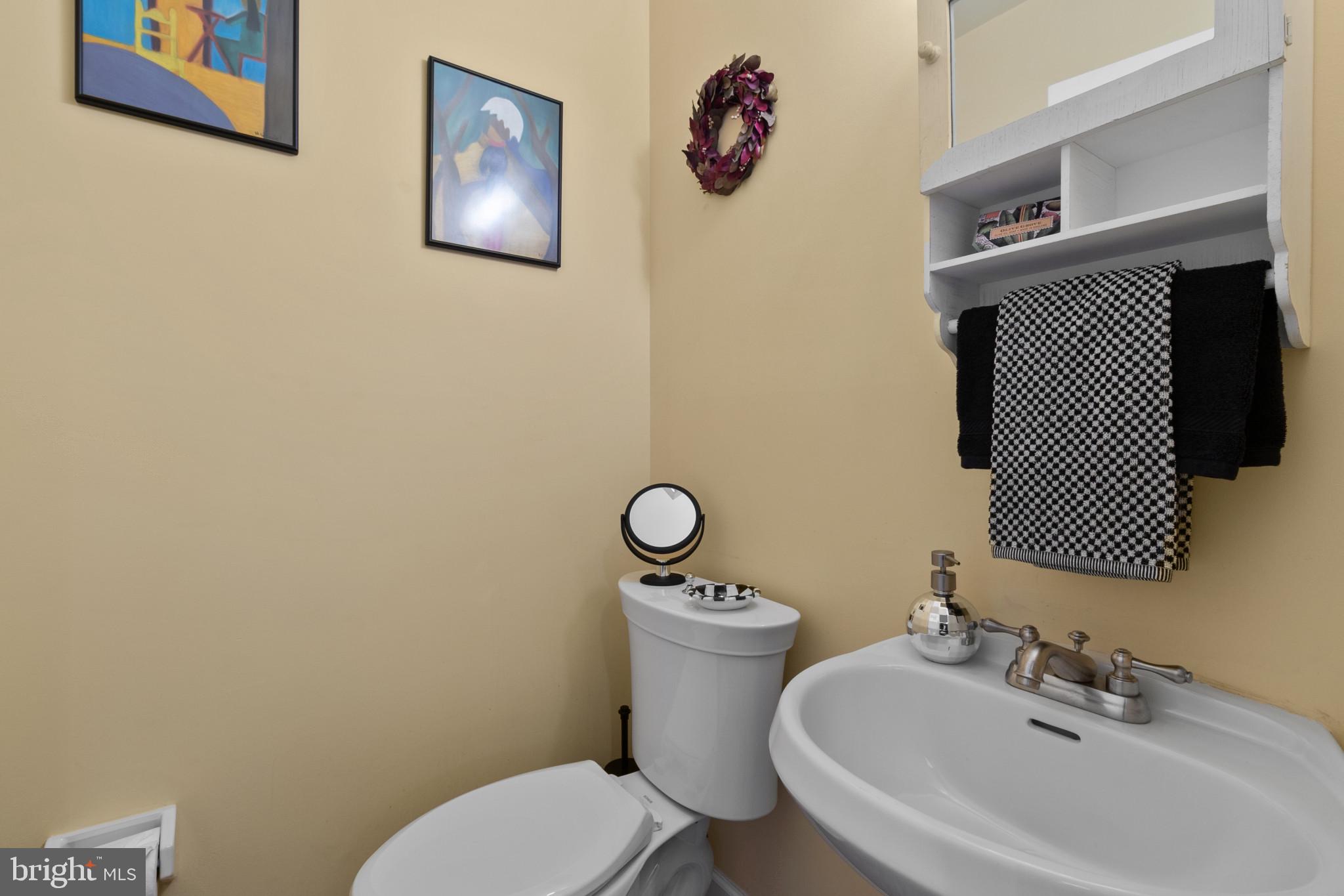 133 Plum Street Moorestown, NJ 08057 - Photo 34 of 54 a bathroom with a toilet sink and mirror