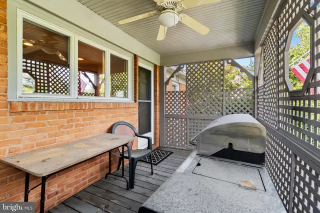 a view of a hallway with wooden floor and stairs