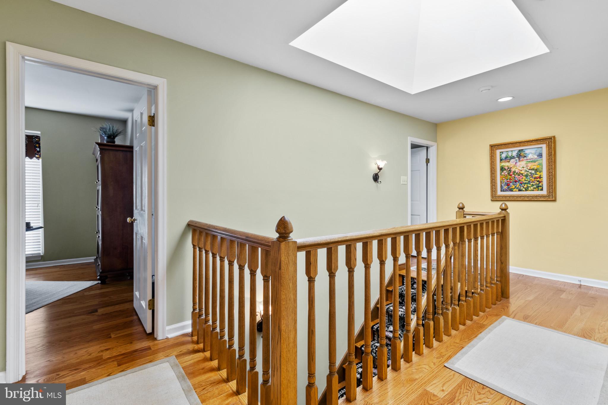 133 Plum Street Moorestown, NJ 08057 - Photo 38 of 54 a view of a hallway with wooden floor and stairs