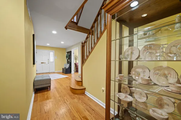 a bedroom with furniture and wooden floor