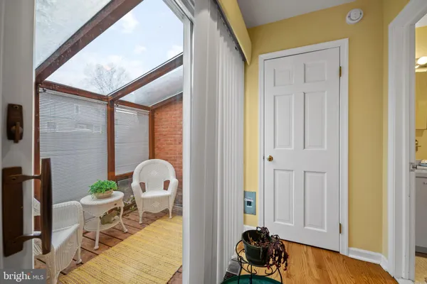 a view of balcony with furniture