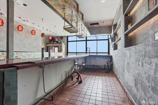 a view of an empty room with stairs