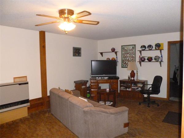 196 Mazarin Street Springfield, MA 01151 - Photo 12 of 25 a living room with furniture and a flat screen tv