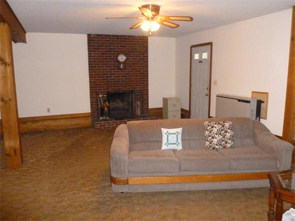 196 Mazarin Street Springfield, MA 01151 - Photo 13 of 25 a living room with furniture and a fireplace