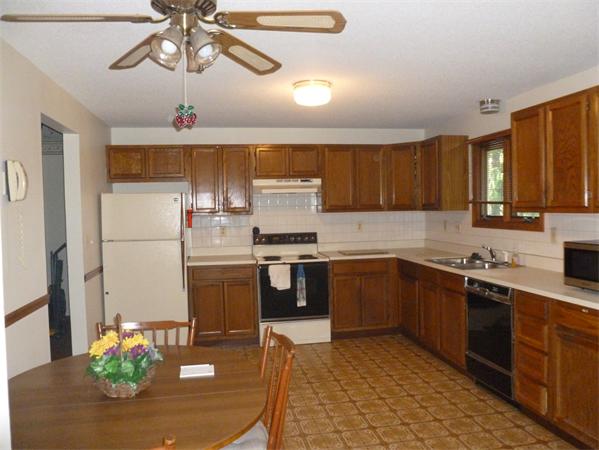 196 Mazarin Street Springfield, MA 01151 - Photo 2 of 25 a kitchen with stainless steel appliances granite countertop a refrigerator a sink dishwasher a stove and white cabinets with wooden floor