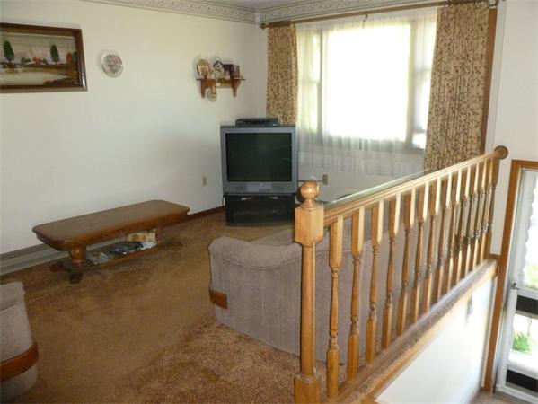 196 Mazarin Street Springfield, MA 01151 - Photo 23 of 25 a living room with furniture and a flat screen tv