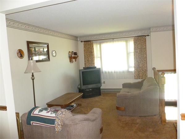 196 Mazarin Street Springfield, MA 01151 - Photo 3 of 25 a living room with furniture and a window