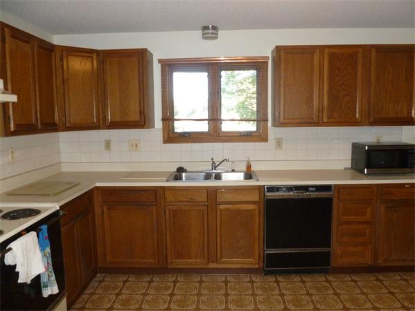 196 Mazarin Street Springfield, MA 01151 - Photo 4 of 25 a kitchen with a sink cabinets and window