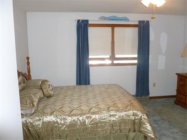 196 Mazarin Street Springfield, MA 01151 - Photo 6 of 25 a bedroom with a bed and a window