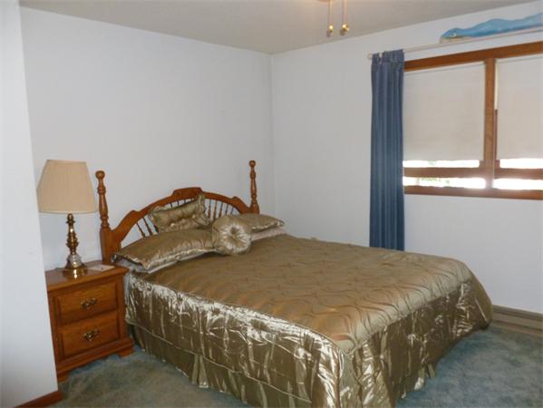 196 Mazarin Street Springfield, MA 01151 - Photo 8 of 25 a bedroom with a bed and a window