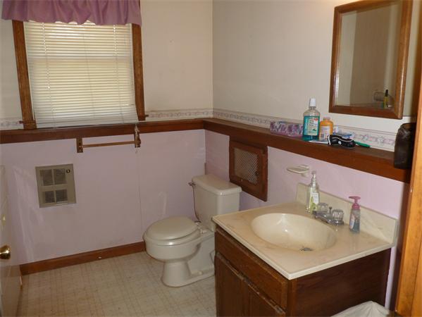 196 Mazarin Street Springfield, MA 01151 - Photo 10 of 25 a bathroom with a granite countertop sink toilet and mirror