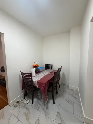 a dining room with a table and chairs