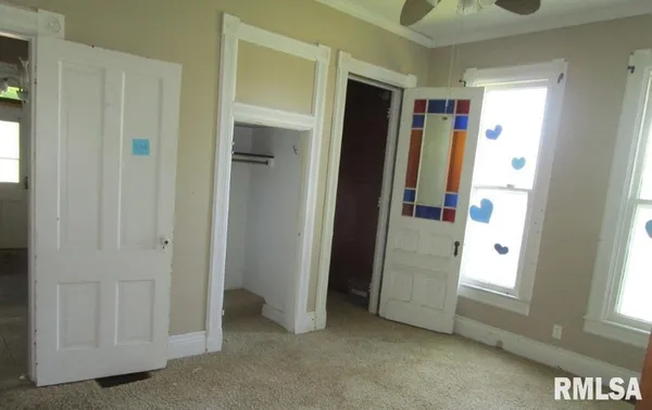 a view of an empty room with a window