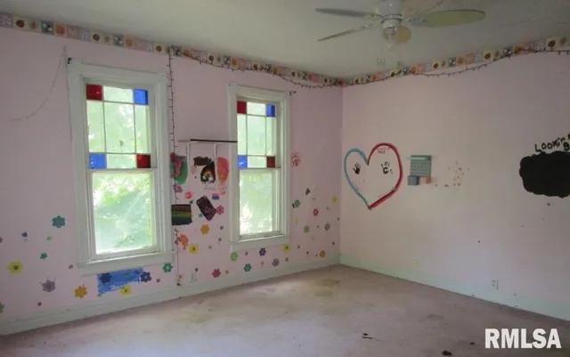 a view of a room with window and hardwood floor