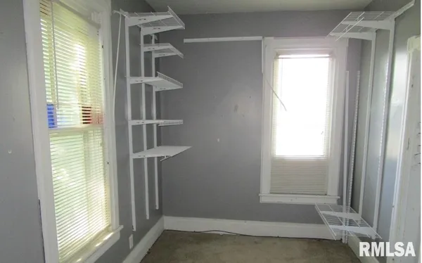 a view of an empty room and window