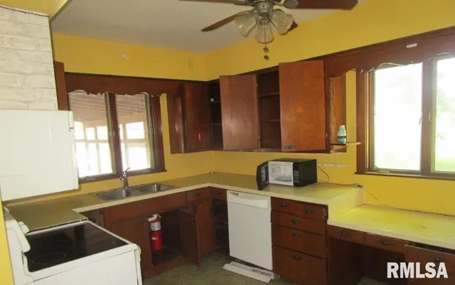 a kitchen with a sink and a window