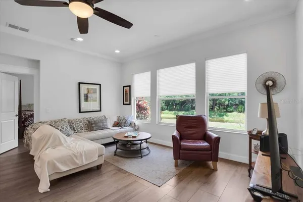 a living room with furniture and a large window