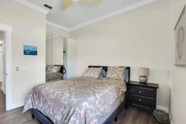 a bedroom with a bed and a tv