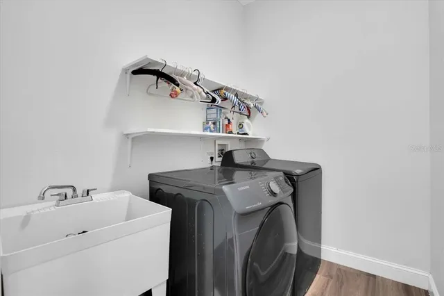 a utility room with dryer and washer