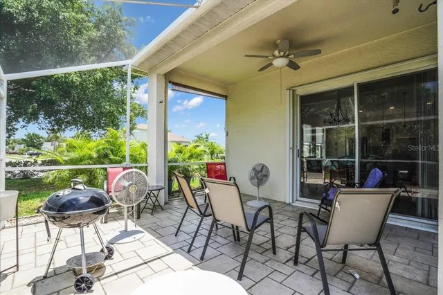 a view of an chairs and table in the patio