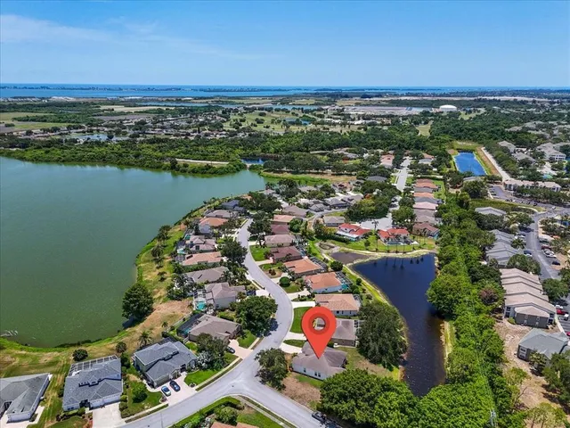 an aerial view of lake and city