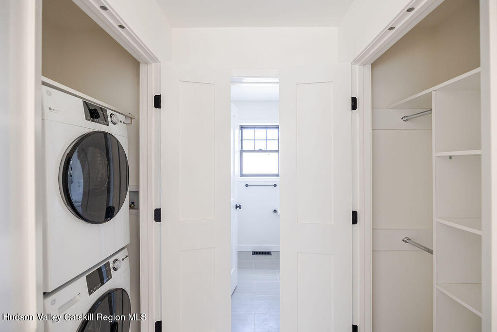 217 Anthony Street Copake, NY 12529 - Photo 14 of 23 a view of a hallway with washer and dryer