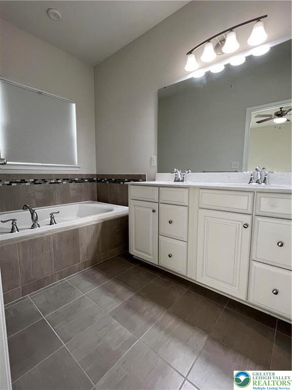 2356 Raya Way Easton, PA 18045 - Photo 14 of 28 Tiled flooring and a separate soaking tub complement the spacious double vanity.