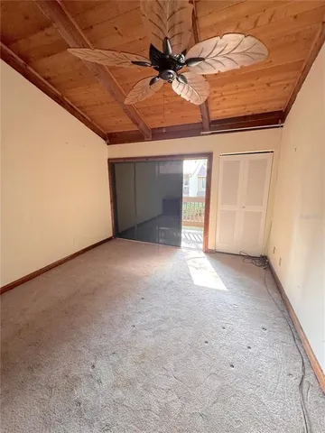 a view of a garage with wooden floor and a window