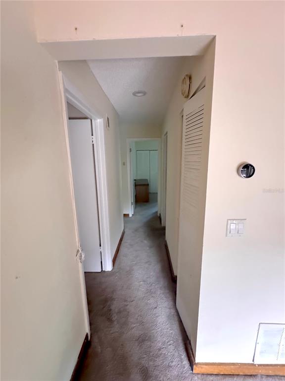 5310 Pebble Beach Drive, Unit F022 Orlando, FL 32811 - Photo 19 of 22 a view of a hallway