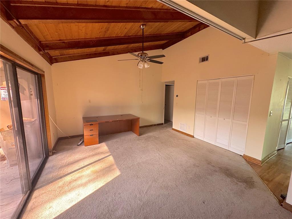 5310 Pebble Beach Drive, Unit F022 Orlando, FL 32811 - Photo 5 of 22 a view of a room with wooden walls and stairs