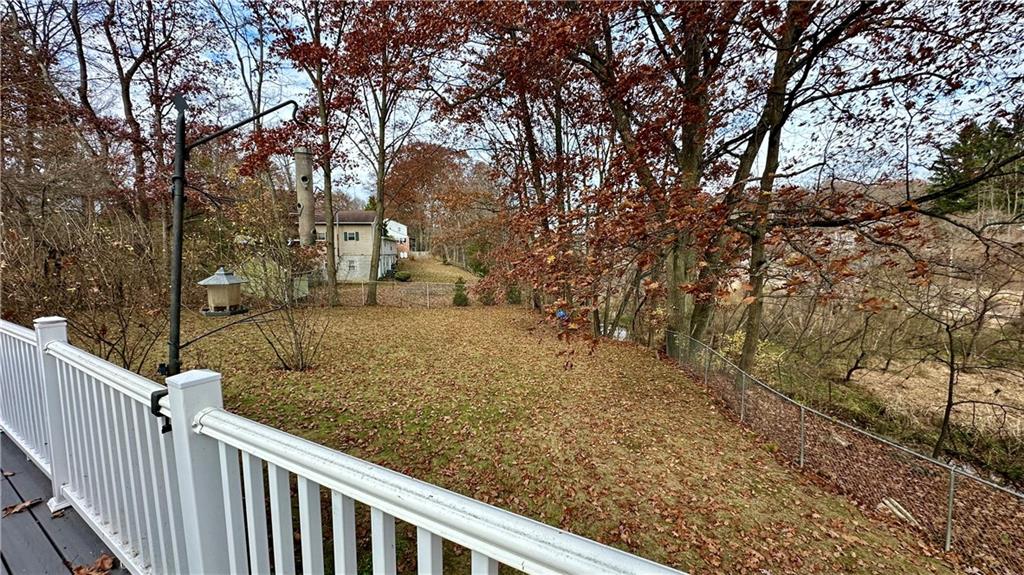 2525 Oakhill Road Gibsonia, PA 15044 - Photo 32 of 36 VIEW OF THE FENCED PARK-LIKE LOT WITH A BACKDROP OF MATURE TREES AND VIEW OF WILLOW RUN DOWN OVER THE HILL!