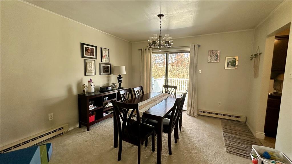 2525 Oakhill Road Gibsonia, PA 15044 - Photo 8 of 36 LOVELY DINING ROOM WITH UPDATED LIGHTING AND ENTRY TO BEAUTIFUL REAR DECK THROUGH PATIO DOORS!