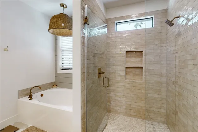 a bedroom with a bed dresser and a window