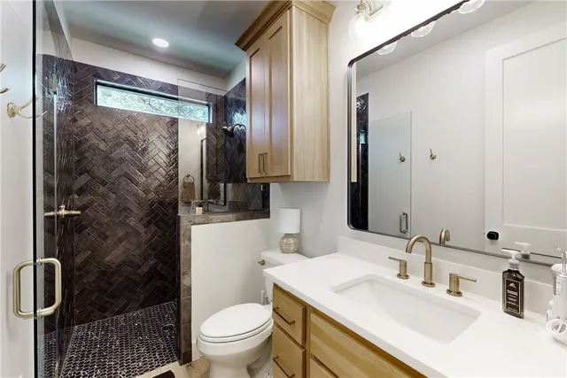 a bedroom with a bed and a ceiling fan