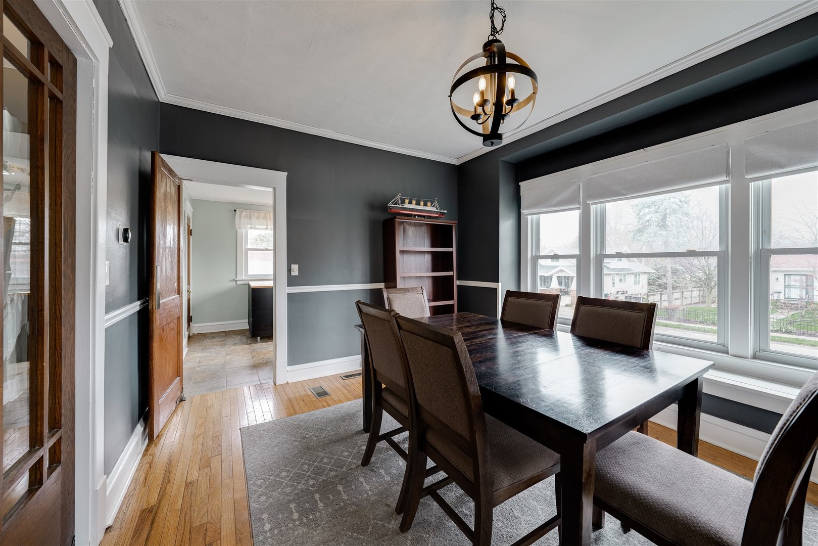 58 White Place Bloomington, IL 61701 - Photo 13 of 38 a view of a dining room with furniture window and wooden floor