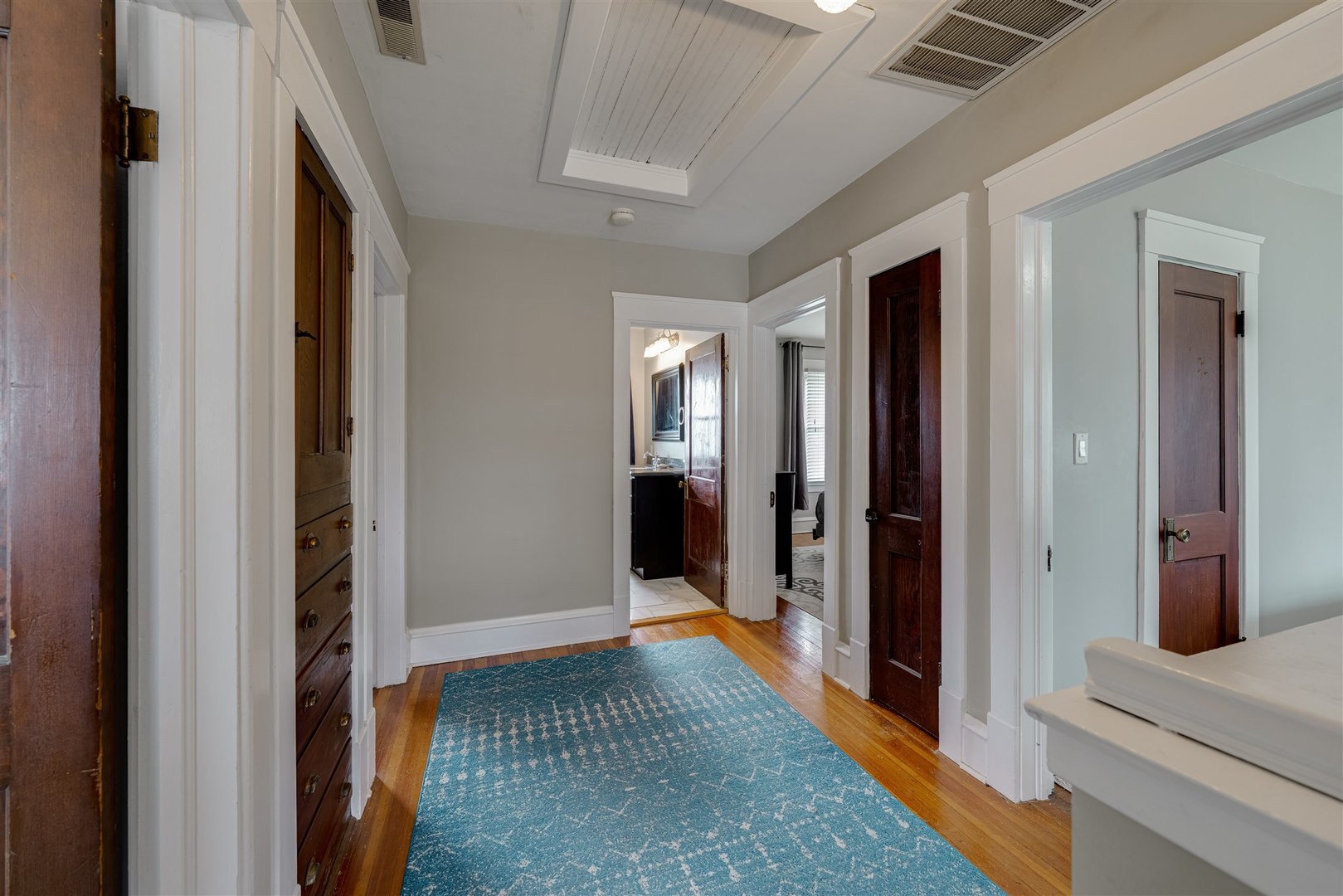 58 White Place Bloomington, IL 61701 - Photo 17 of 38 a view of a hallway with wooden floor and staircase